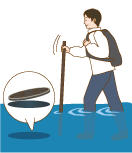 長い棒を使いながら注意して歩く男性のイラスト